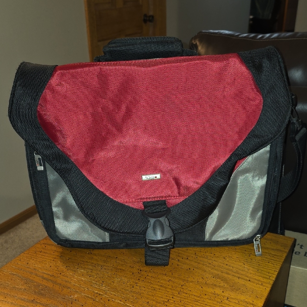 Like New Modern Black and Red Messenger Bag with Durable Design
